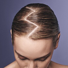 birdseye view of a womans head with a zig zag part in hair